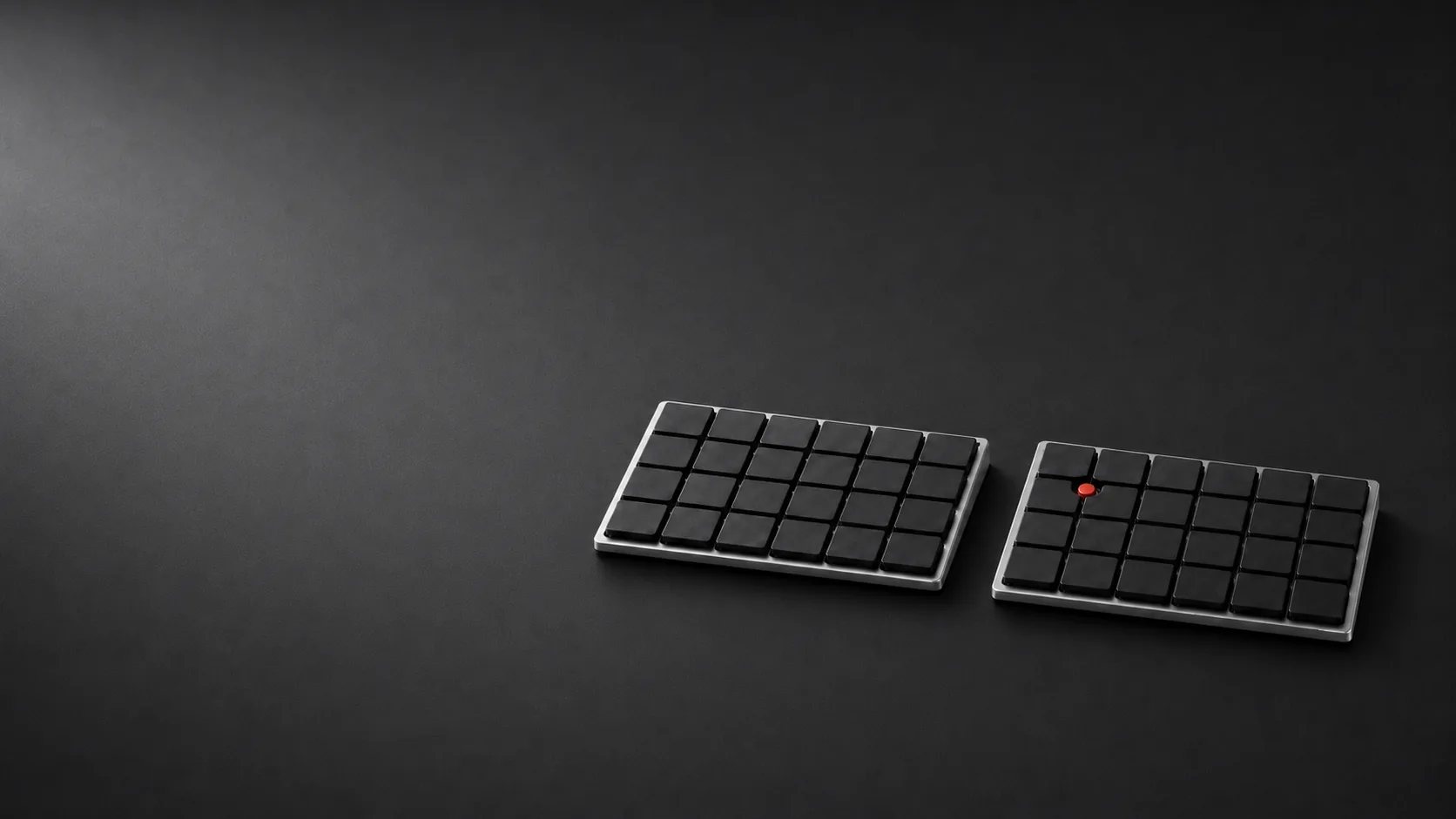 暗いデスクに置かれたair point分割キーボード